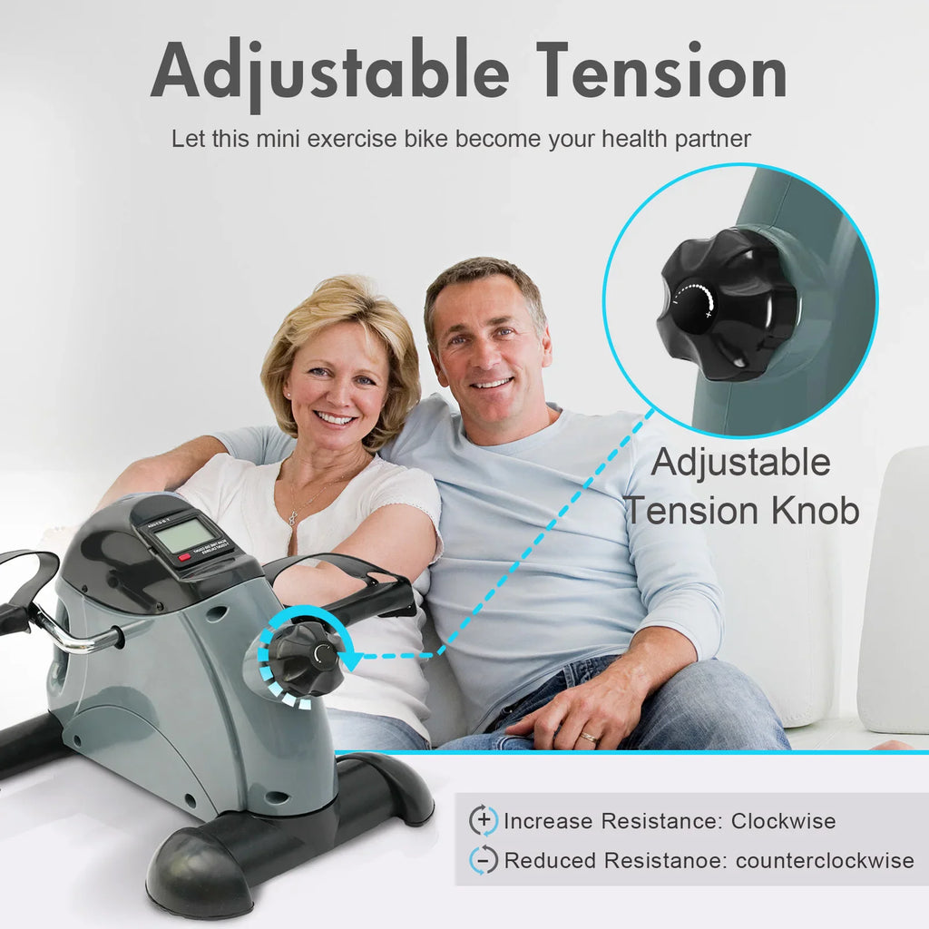 Senior couple using a mini exercise bike for fitness and rehabilitation