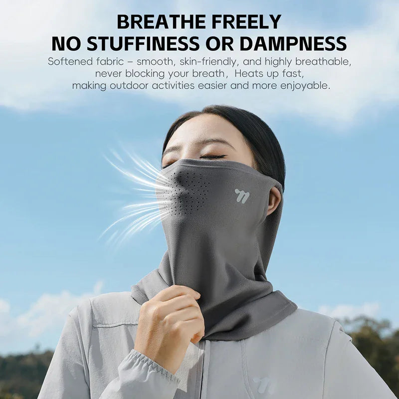 A woman wearing a breathable grey thermal face mask to show air circulation during outdoor activities