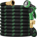 Green and black garden hose with a nozzle and brass fittings
