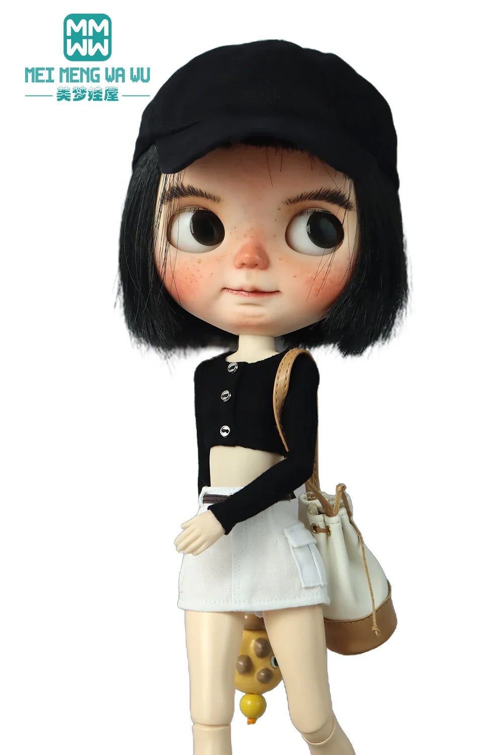 Doll with short dark hair in a black cap, black long sleeve cropped knit top, white miniskirt and bag