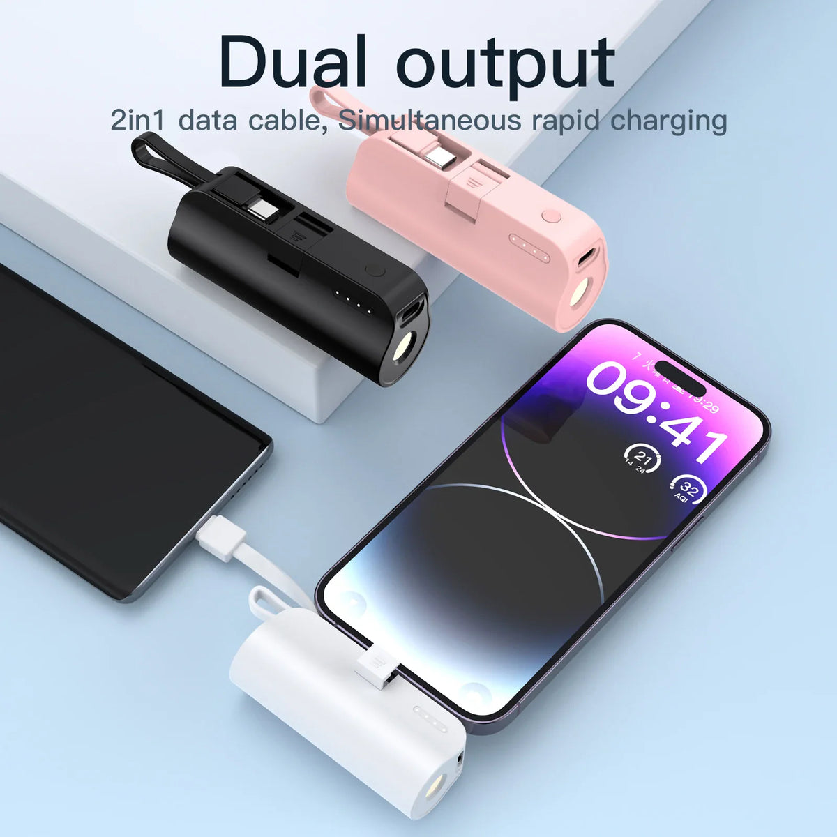 Mini portable power bank with built-in cable, shown in black, pink, and white variants charging mobile phones.