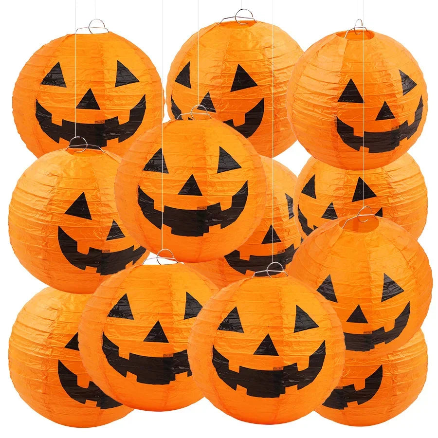 Set of multiple orange jack-o'-lantern paper lanterns
