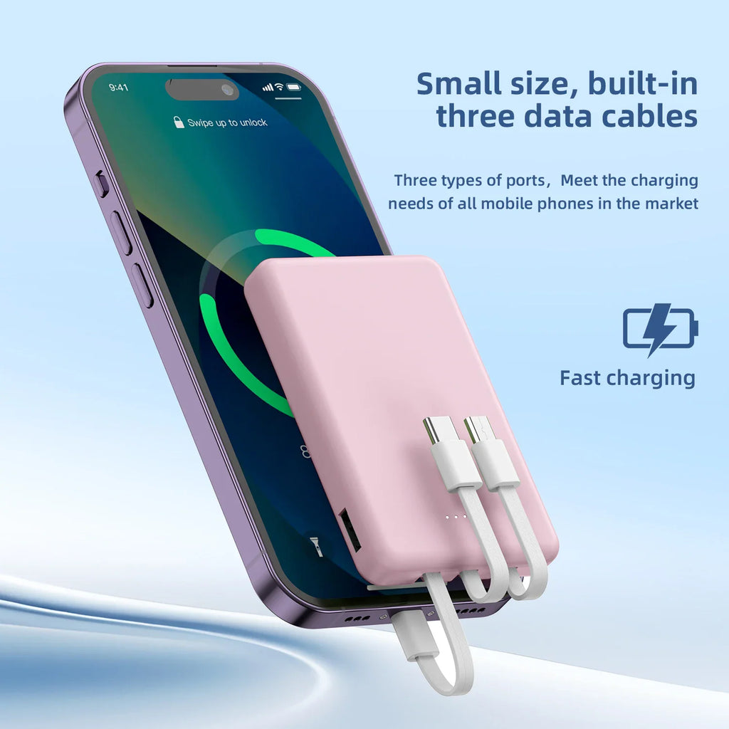 A pink mini power bank with built-in cables charging a smartphone.