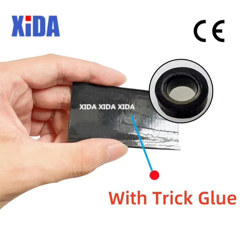 A hand holding a piece of black heat shrink tubing to show the glue lining