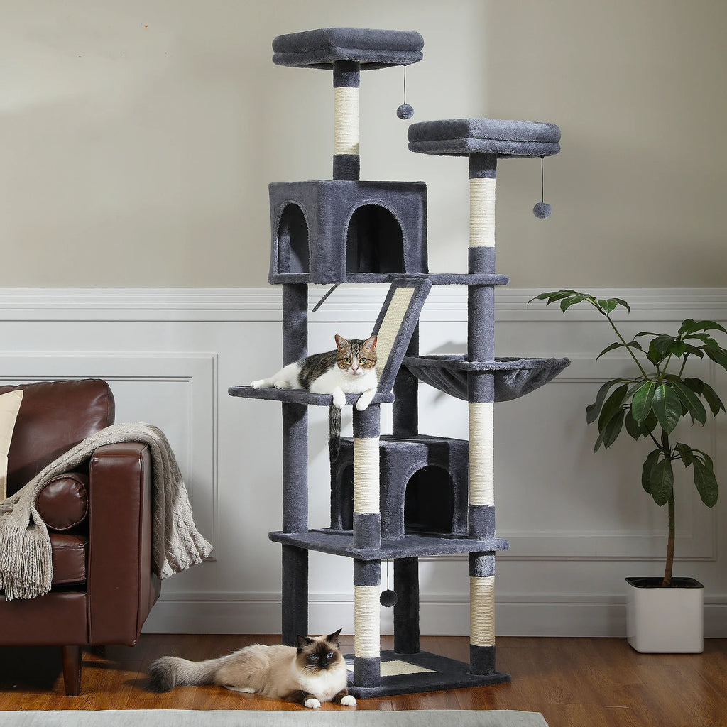 Large multi-level dark grey plush cat tree tower with scratching posts, perches, and condos with two cats.