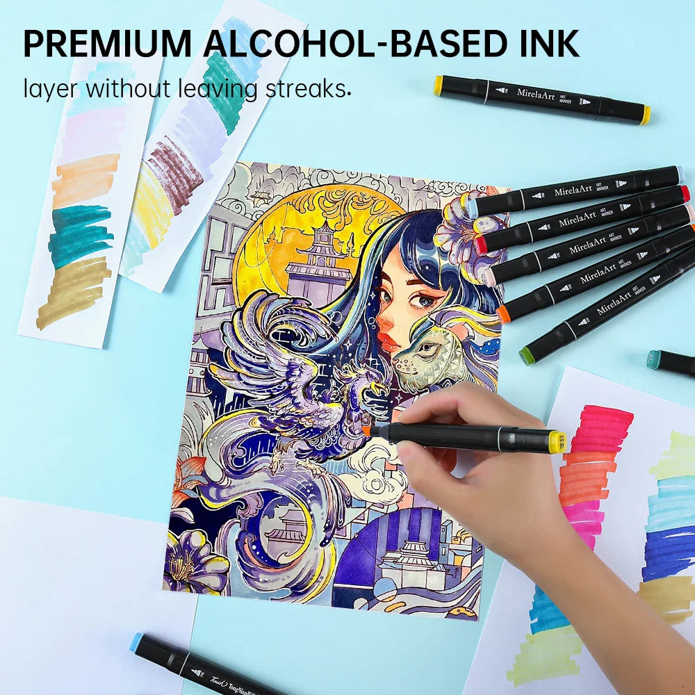 Art markers being used to color an intricate fantasy drawing of a phoenix and woman.