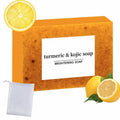 Turmeric and kojic brightening soap bar with a mesh pouch and lemon slices