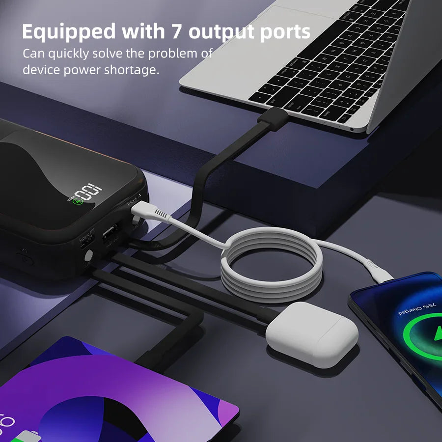 Black portable power bank charging multiple electronic devices simultaneously.