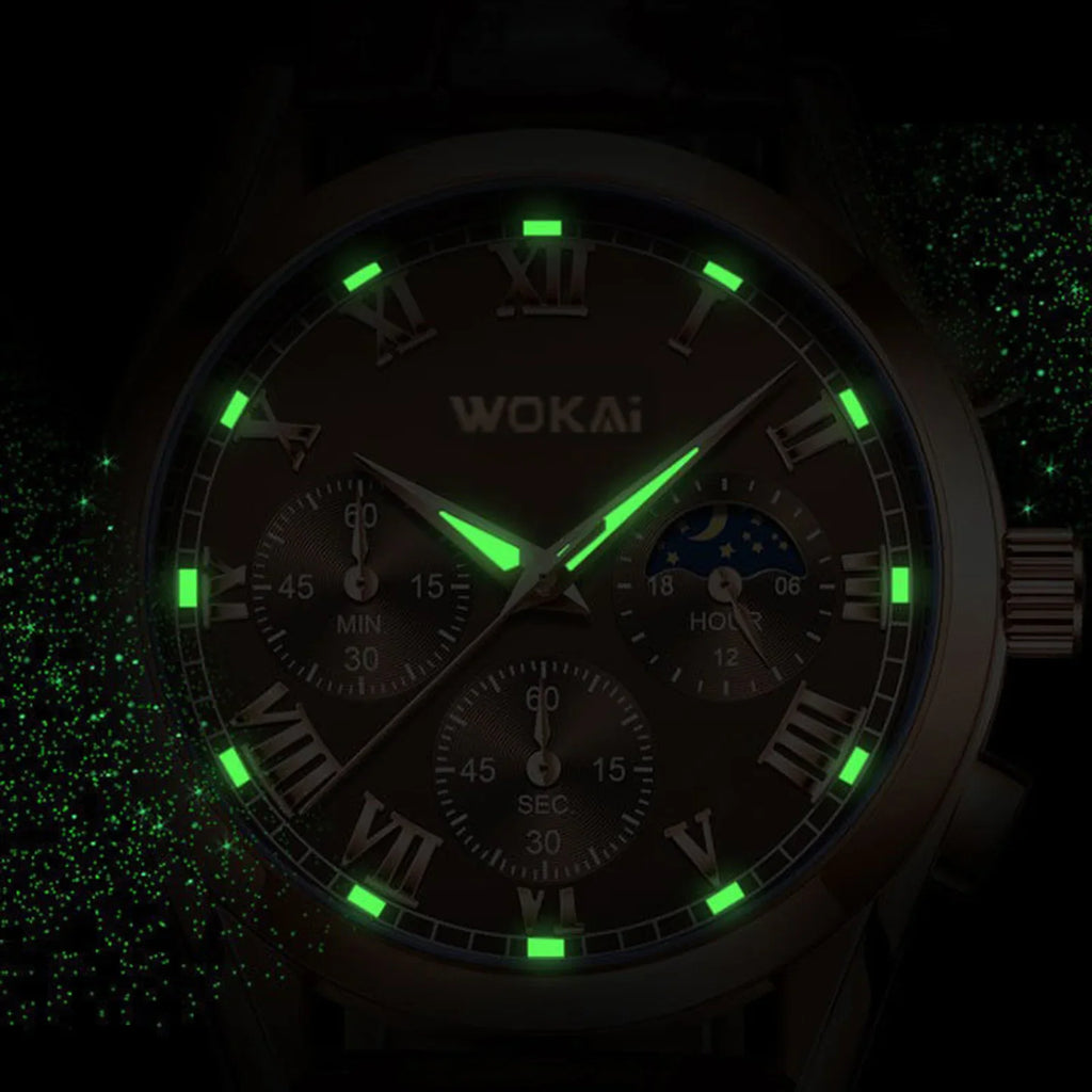 Rose gold tone quartz watch dial with glowing luminous hands and markers in the dark