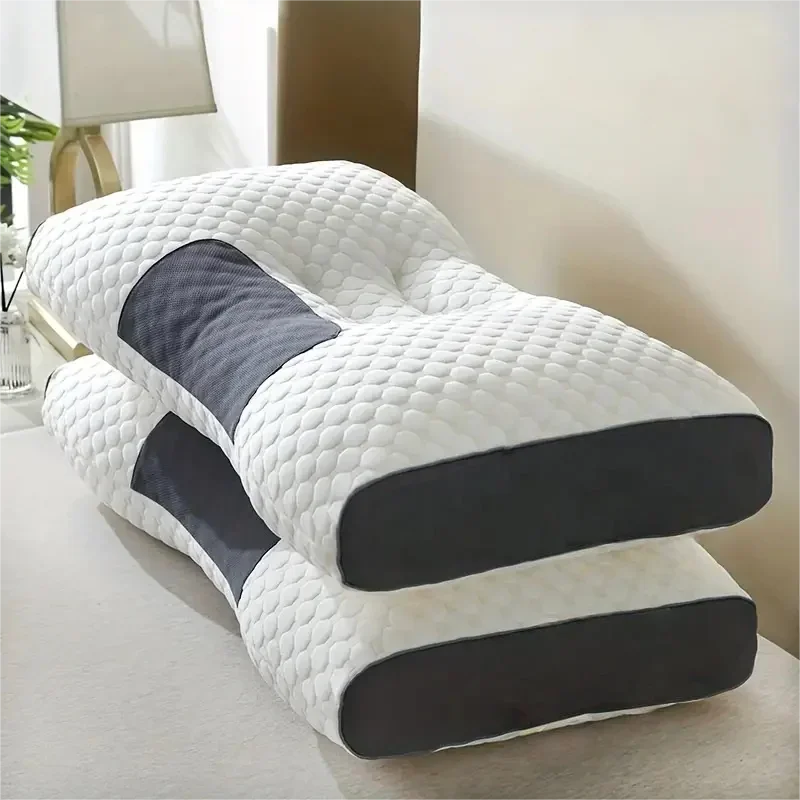 Two white and grey ergonomic orthopedic contour pillows stacked