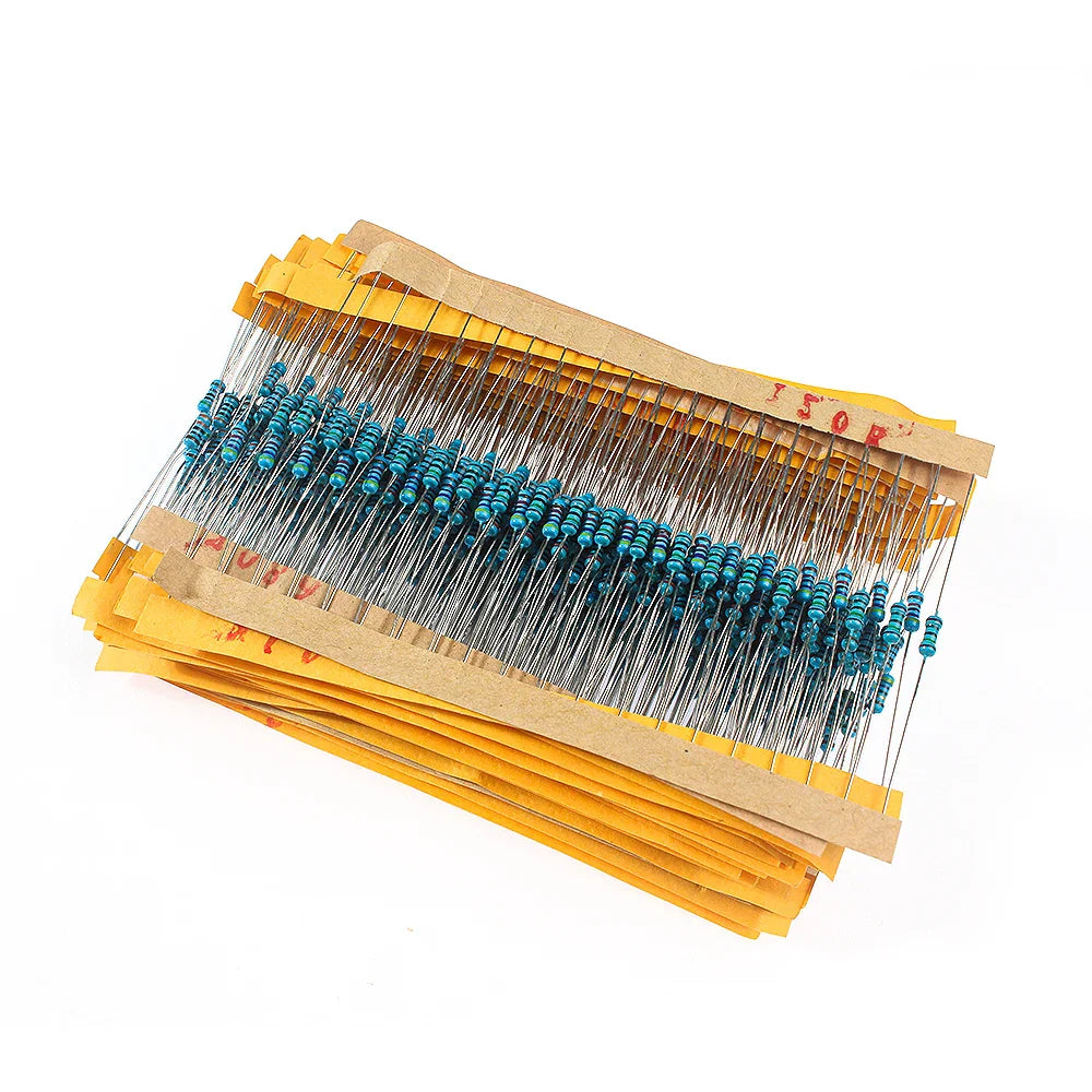A large collection of blue metal film resistors mounted on yellow paper strips