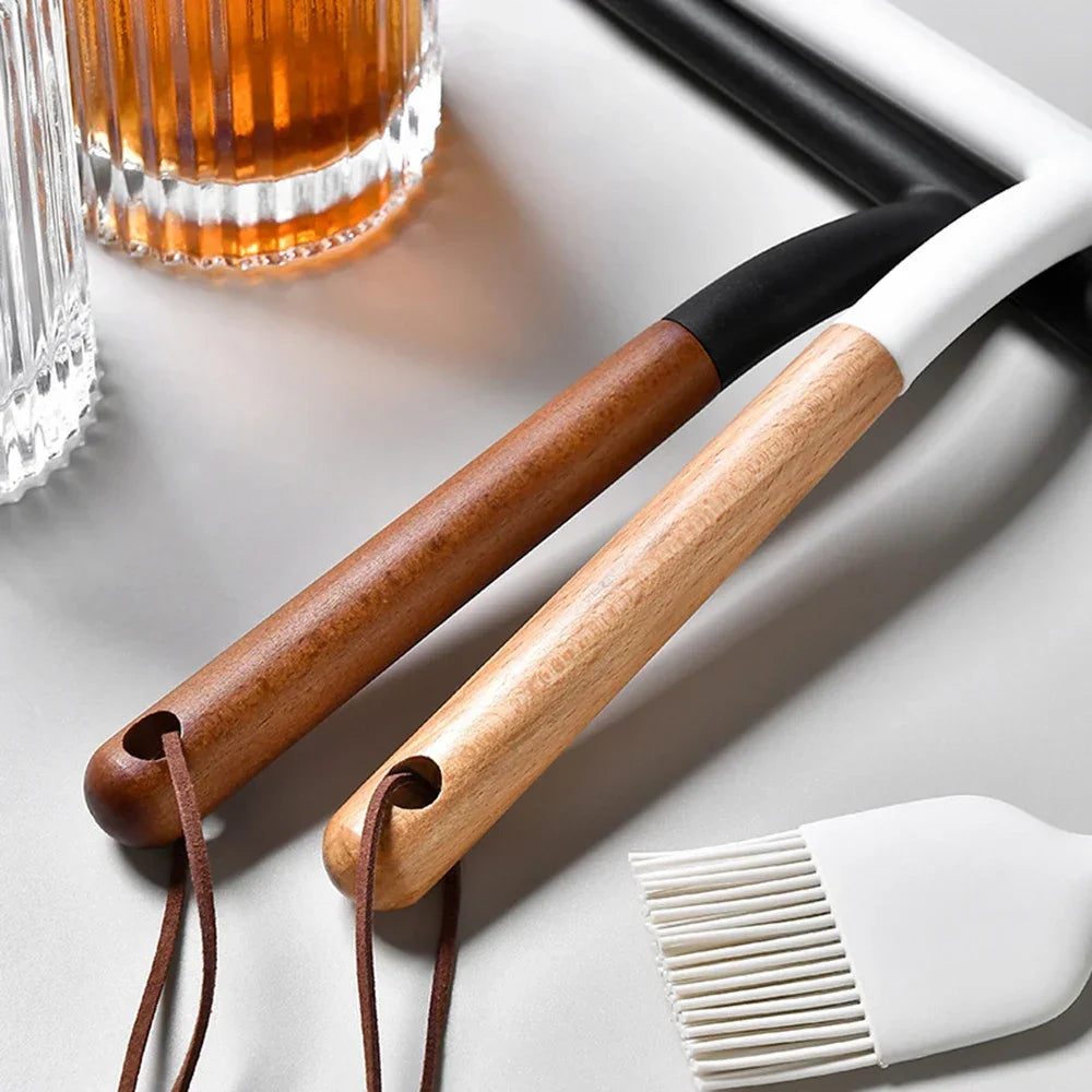 Detailed view of the wooden handles and leather hanging straps on silicone wipers