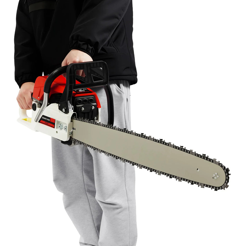Person holding a 22-inch red and white petrol chainsaw