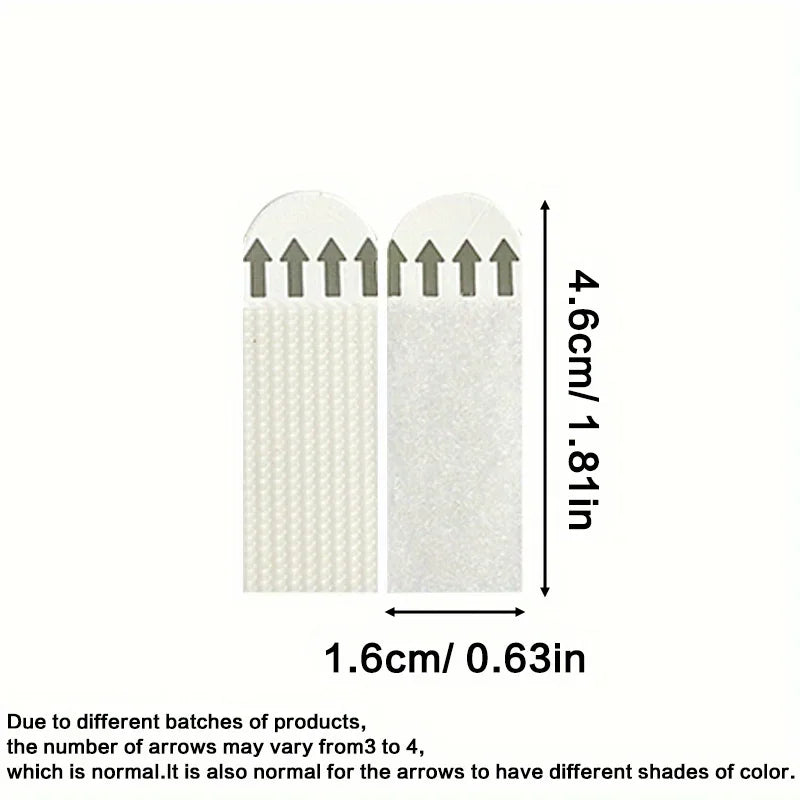 Two adhesive picture hanging strips with dimensions in centimeters and inches.