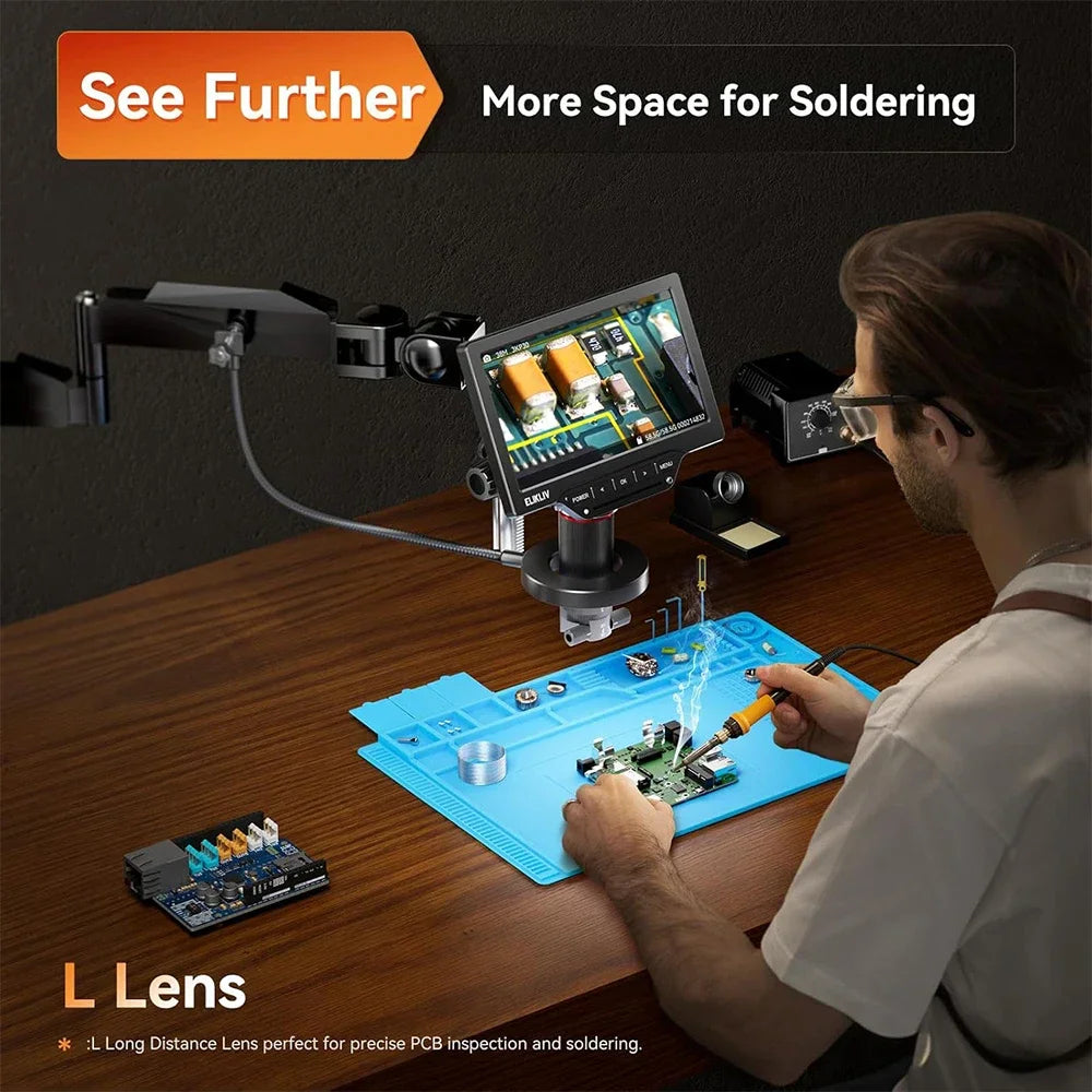 Person soldering on a PCB using a long distance lens digital microscope setup.