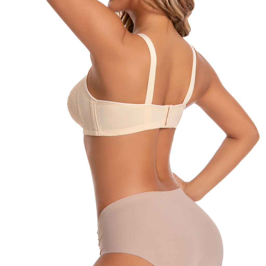 A side view of a woman wearing a beige wireless bra with wide adjustable straps