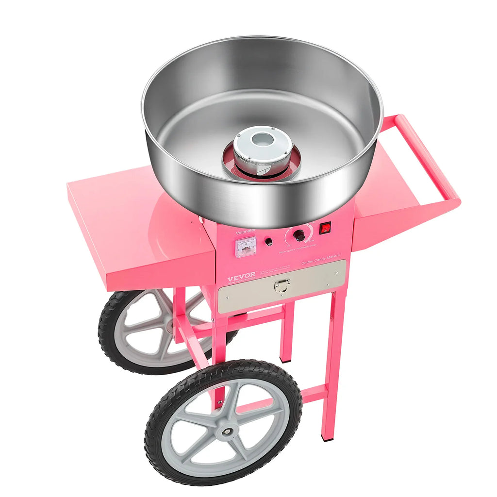 A pink commercial electric cotton candy maker with a stainless steel bowl and cart