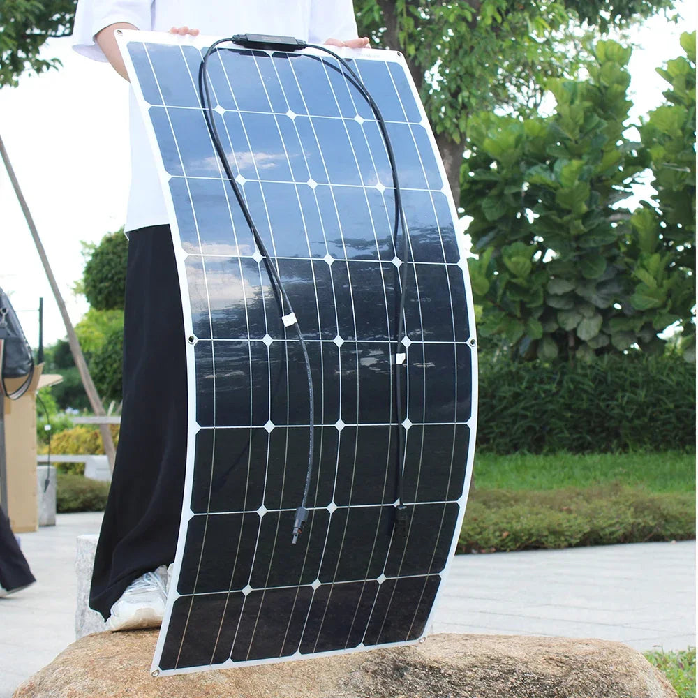 100W flexible monocrystalline solar panel with a thin, dark surface designed for boats and RV roofs