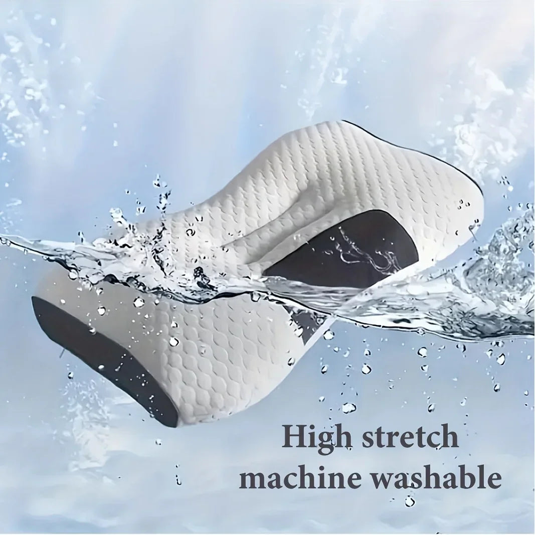 White and grey ergonomic orthopedic contour pillow being washed with water