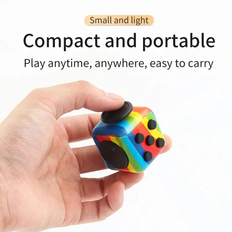 Hand holding a rainbow patterned sensory fidget cube toy