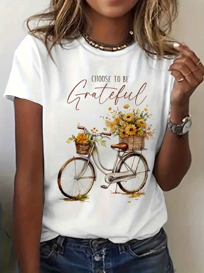 White short sleeve t-shirt with a vintage bicycle and sunflower graphic print