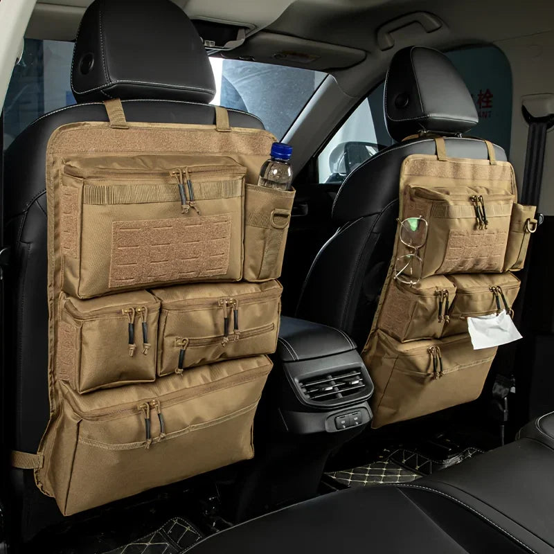 Tan tactical car seat back organizer with multiple storage pockets in a car interior