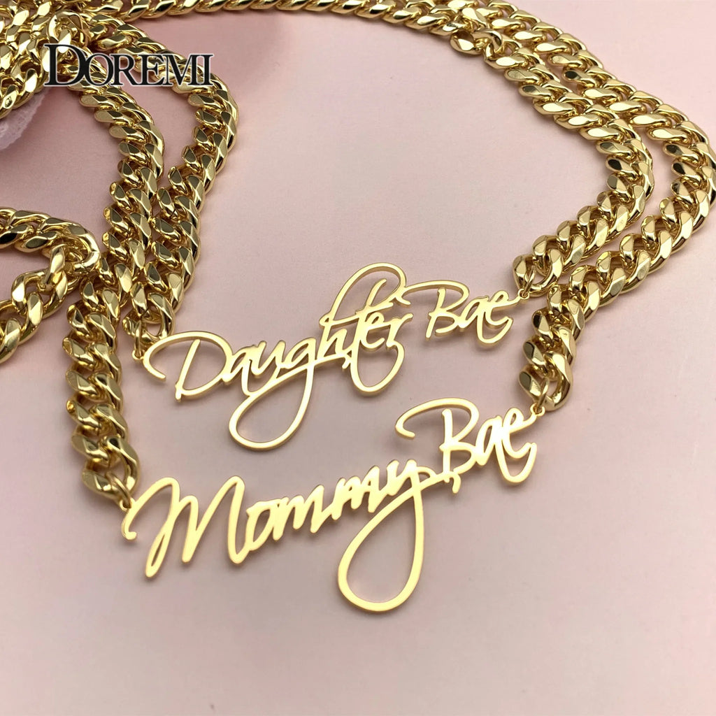 Gold custom nameplate necklaces with thick cuban chains