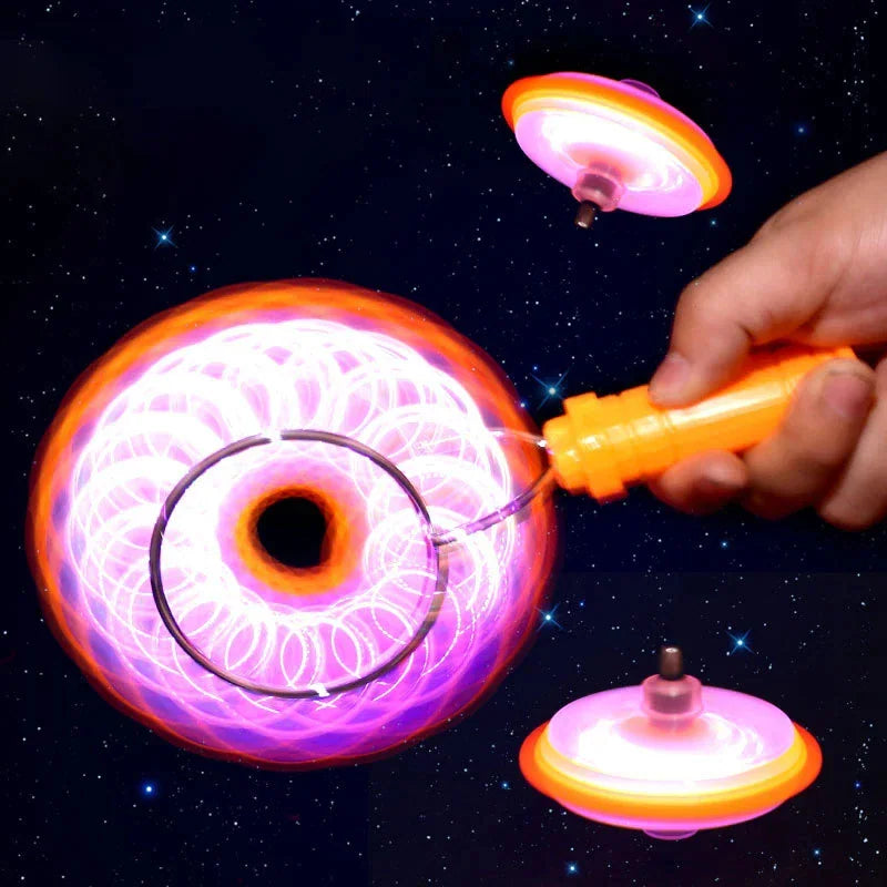 Magnetic spinning top toy with LED lights in motion against a starry background