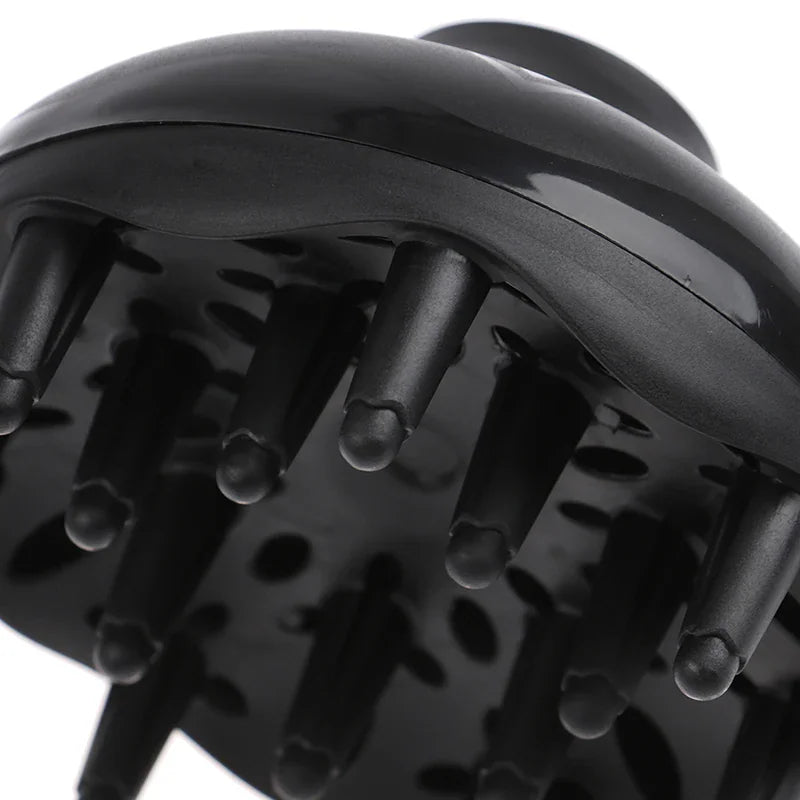 Close-up of black plastic hair diffuser attachment with prongs