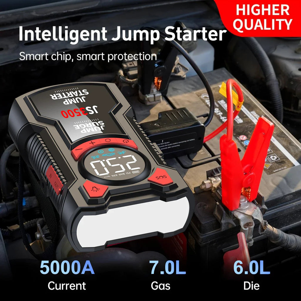 Portable jump starter with clamps connected to a car battery under the hood