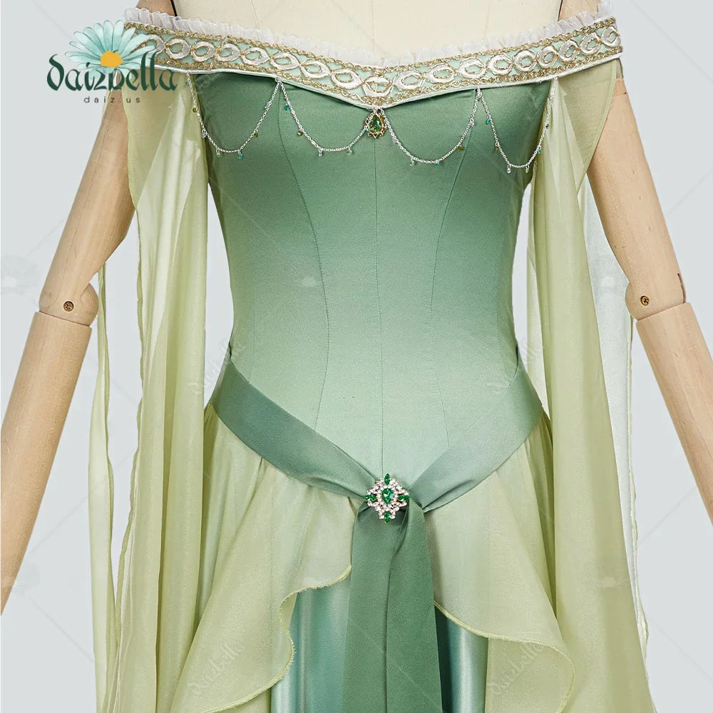 Close up of the bodice of a green renaissance elf dress with decorative trim and jewel accent.