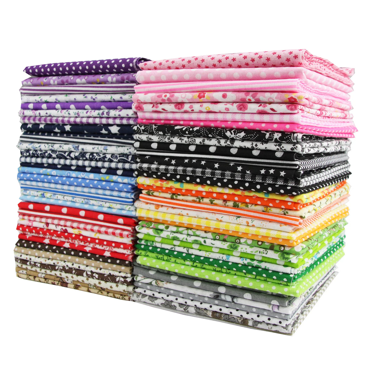A stack of assorted patterned and coloured cotton fabric squares, divided into two piles.