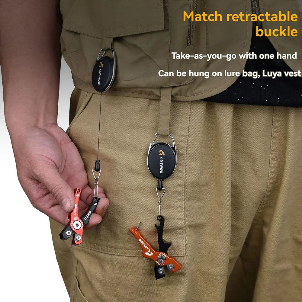 Mini fishing pliers with retractable clip attached to fishing vest
