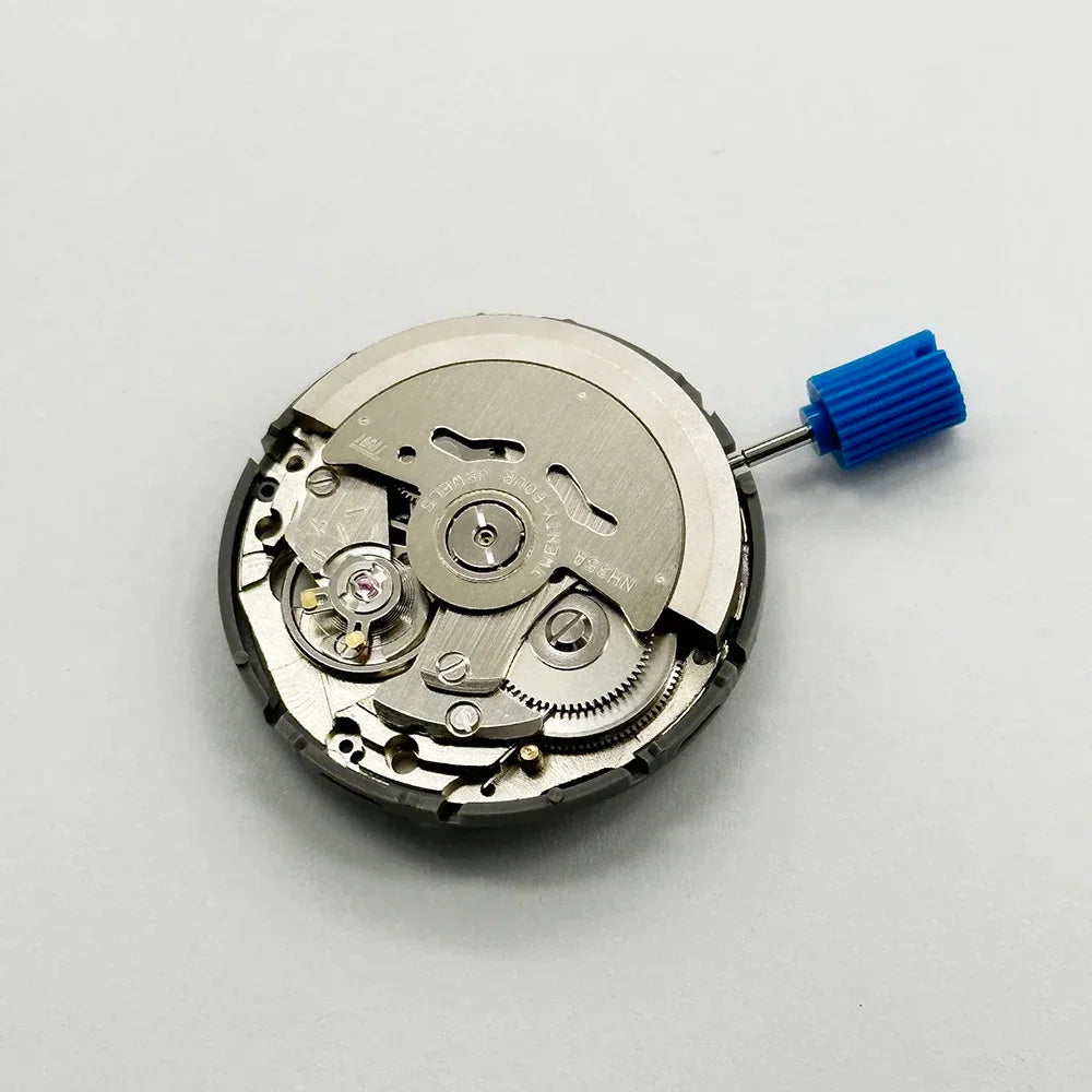 Mechanical automatic watch movement top view with blue crown