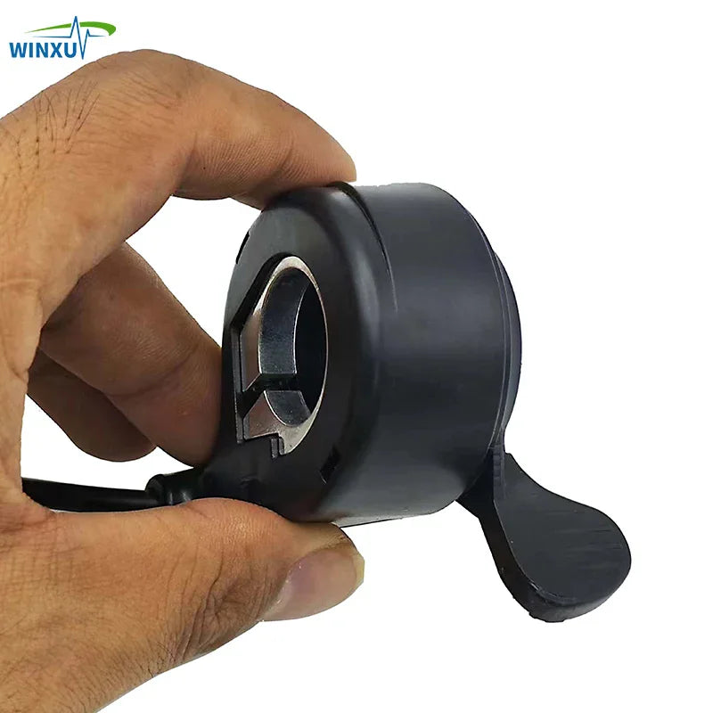 Hand holding the electric bike thumb throttle assembly