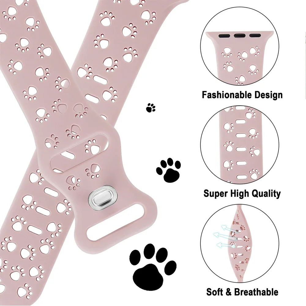 Pink silicone watch band with paw print cutouts and feature close-up circles