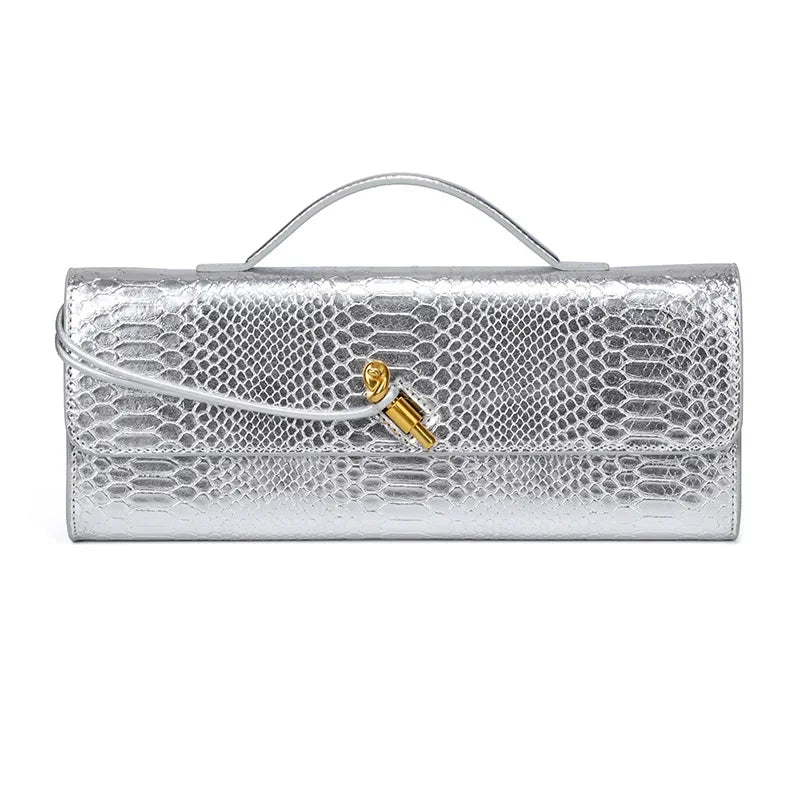 Silver metallic faux crocodile skin long clutch bag with a top handle and gold knot clasp