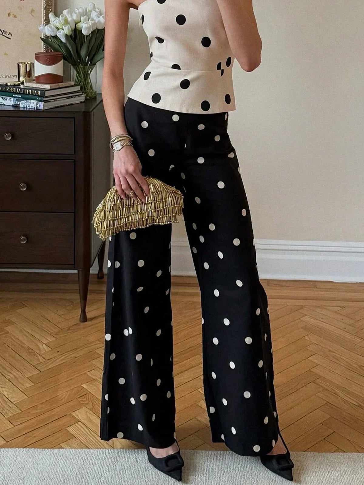 High-waisted black polka dot wide-leg trousers