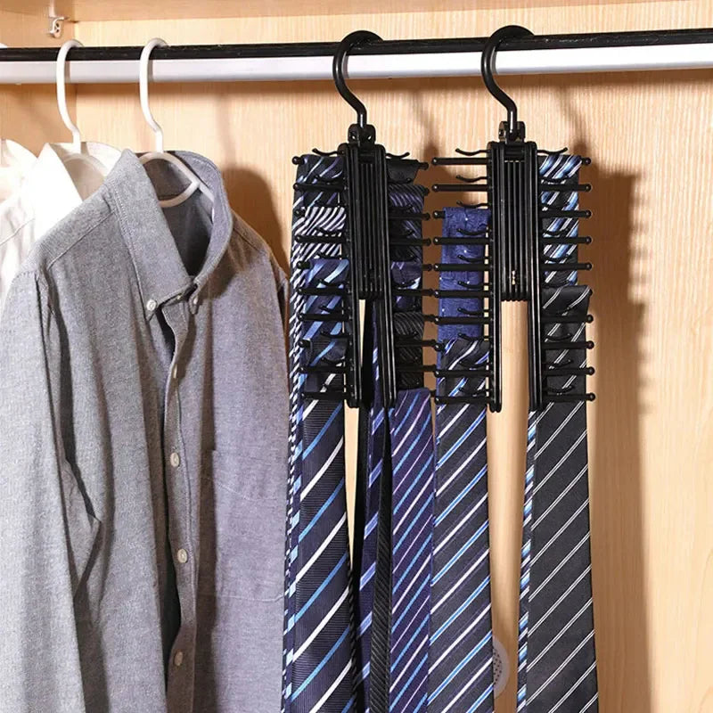 A black plastic tie hanger holding multiple patterned ties inside a wooden closet.