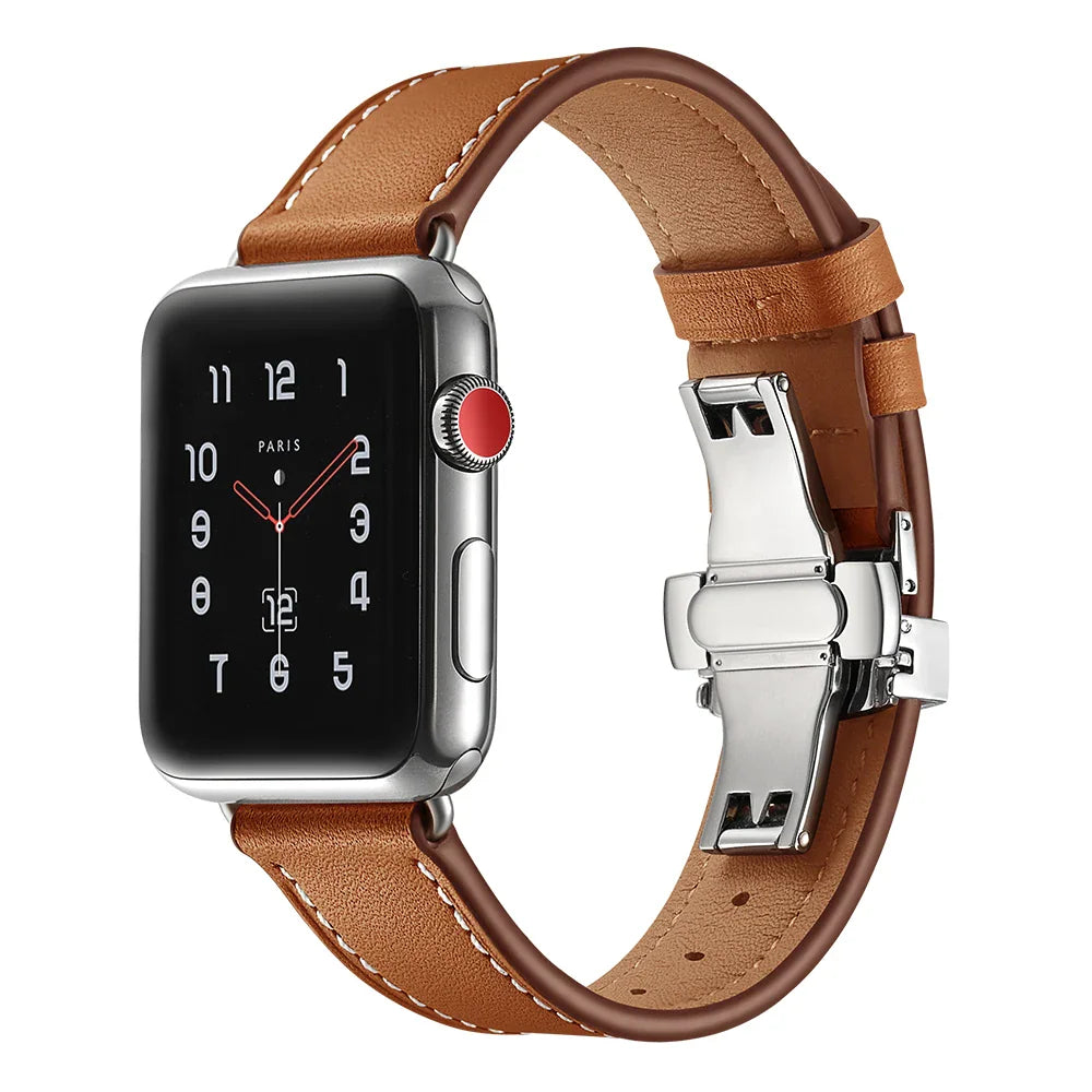 Brown leather watch strap attached to silver smart watch with metal butterfly clasp