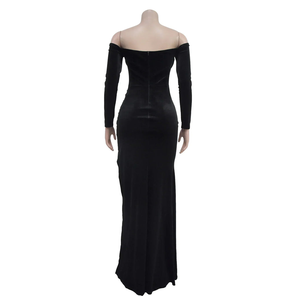 Back view of black velvet off-shoulder long evening dress on mannequin