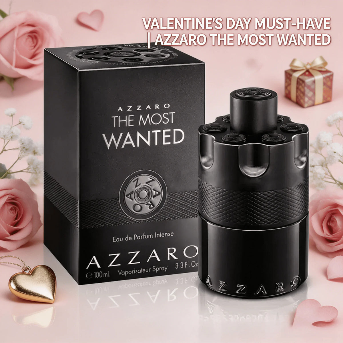 Azzaro The Most Wanted Eau de Parfum Intense fragrance bottle next to its box, surrounded by pink roses and heart decor