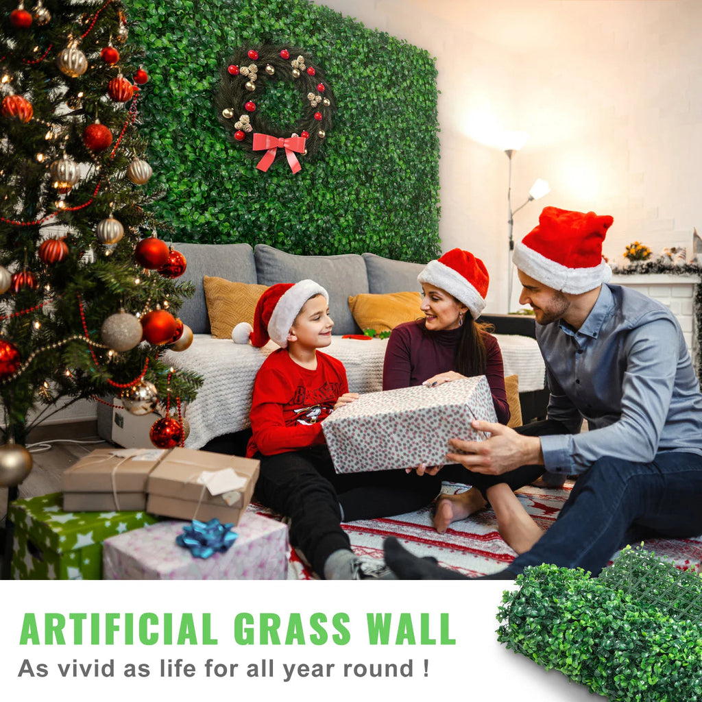 Family decorating a room with an artificial boxwood grass wall backdrop