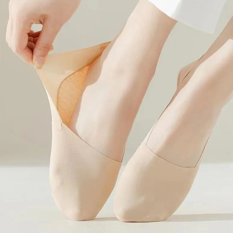 Beige invisible low-cut liner sock on a foot