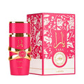 Pink bottle of Yara Candy perfume standing next to its floral patterned retail box