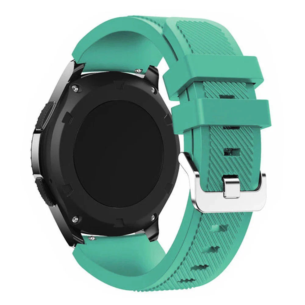 A teal silicone sport watch band attached to a black smartwatch case, back view.