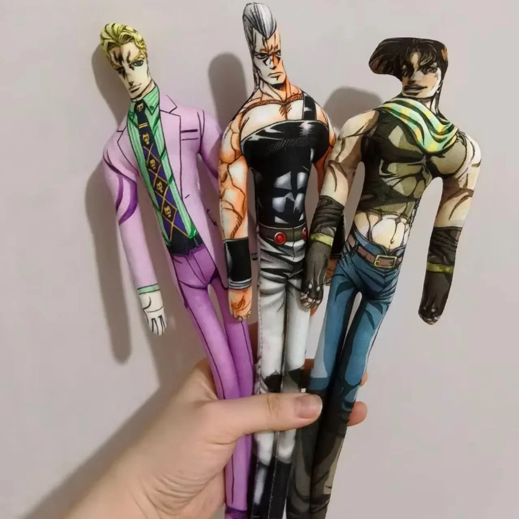 Hand holding three anime character plush dolls dressed in patterned outfits