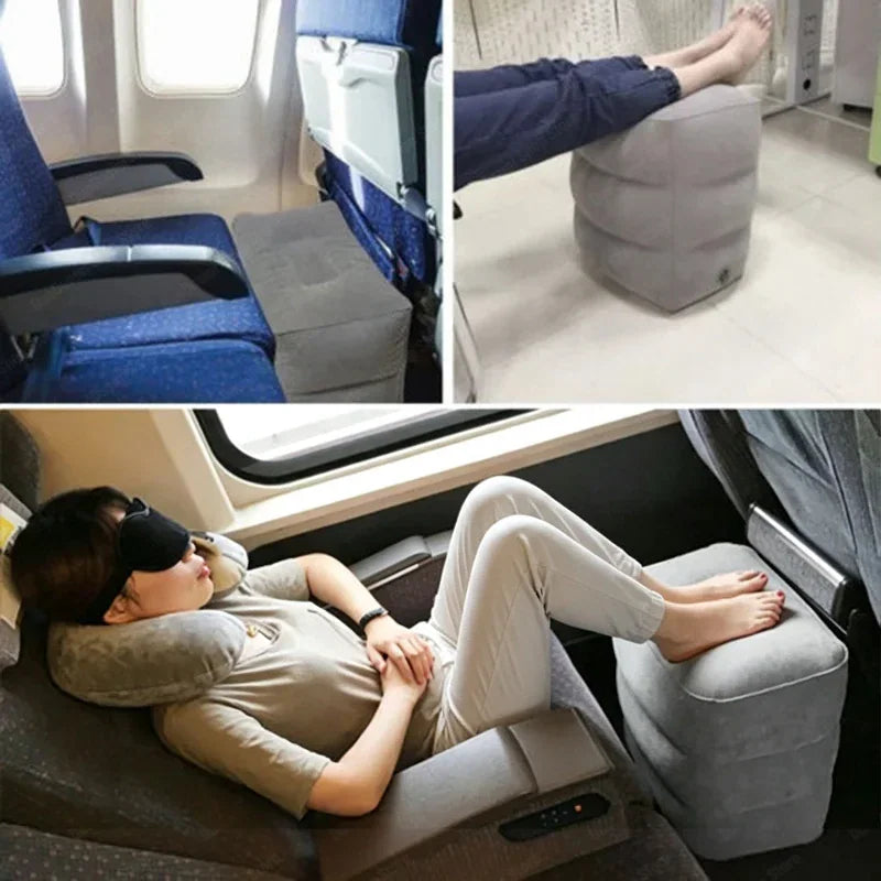 Grey inflatable footrest pillow being used by a passenger on an airplane