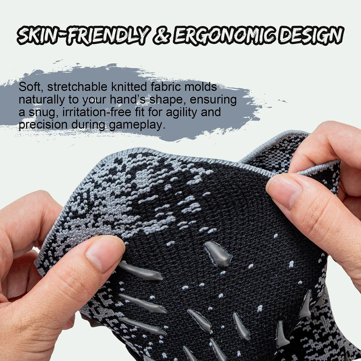 Close up of hands demonstrating the flexible knitted fabric of a goalkeeper glove