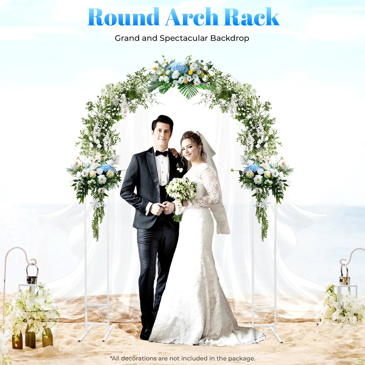 White metal round arch frame decorated with flowers on a beach with a wedding couple